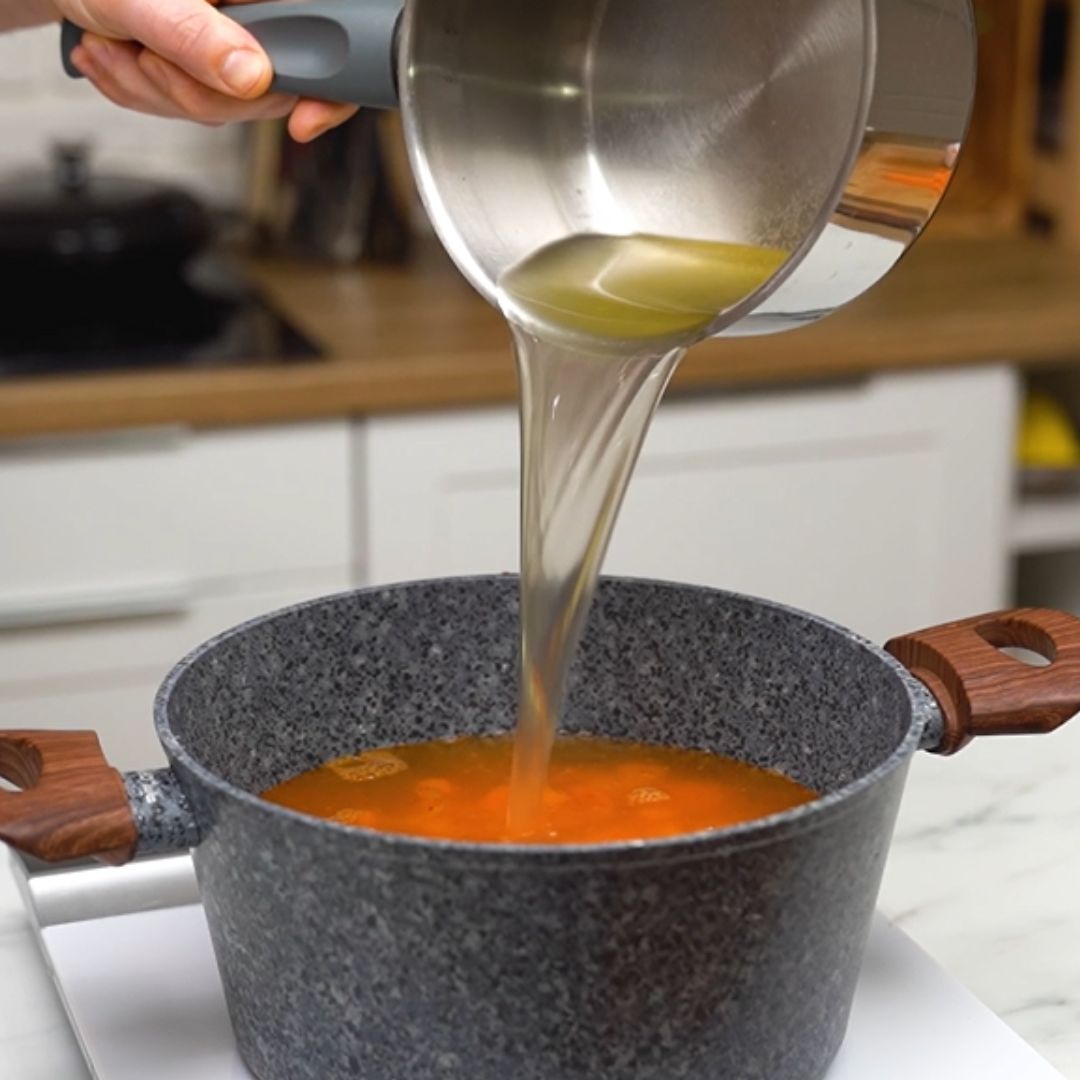 Into the pot goes, among other things, homemade vegetable broth.