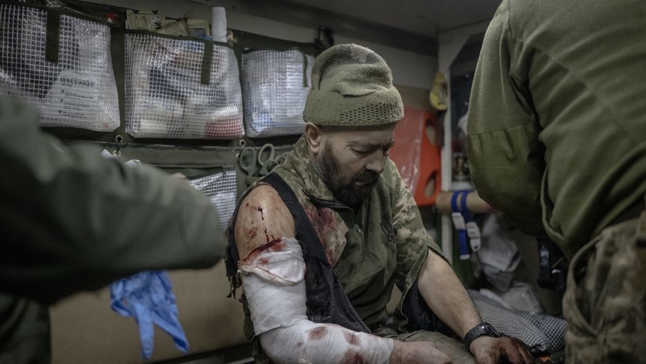AVDIIVKA, UKRAINE - DECEMBER 31: Ukrainian military medical personnel treat wounded soldiers at stabilization point as Russia-Ukrainian war continues on the New Year's Eve on frontlines in the direction of Avdiivka city, in Donetsk Oblast, Ukraine on December 31, 2023. On the last day of 2023, the tank units from the 59th mechanized brigade actively engaged in multiple rounds of shooting, targeting Russian positions amidst heavy fire. (Photo by Ozge Elif Kizil/Anadolu via Getty Images)