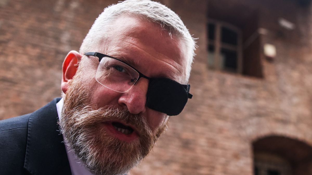 Grzegorz Braun, far-right leader of the Confederation of the Polish Crown party and European Parliament member, is seen in front of the Institute of National Remembrance in Krakow, Poland on August 25th, 2026. Braun was summoned for questioning in connection with allegations of publicly questioning the existence of gas chambers in the Nazi German concentration and extermination camp Auschwitz-Birkenau. (Photo by Beata Zawrzel/NurPhoto via Getty Images)