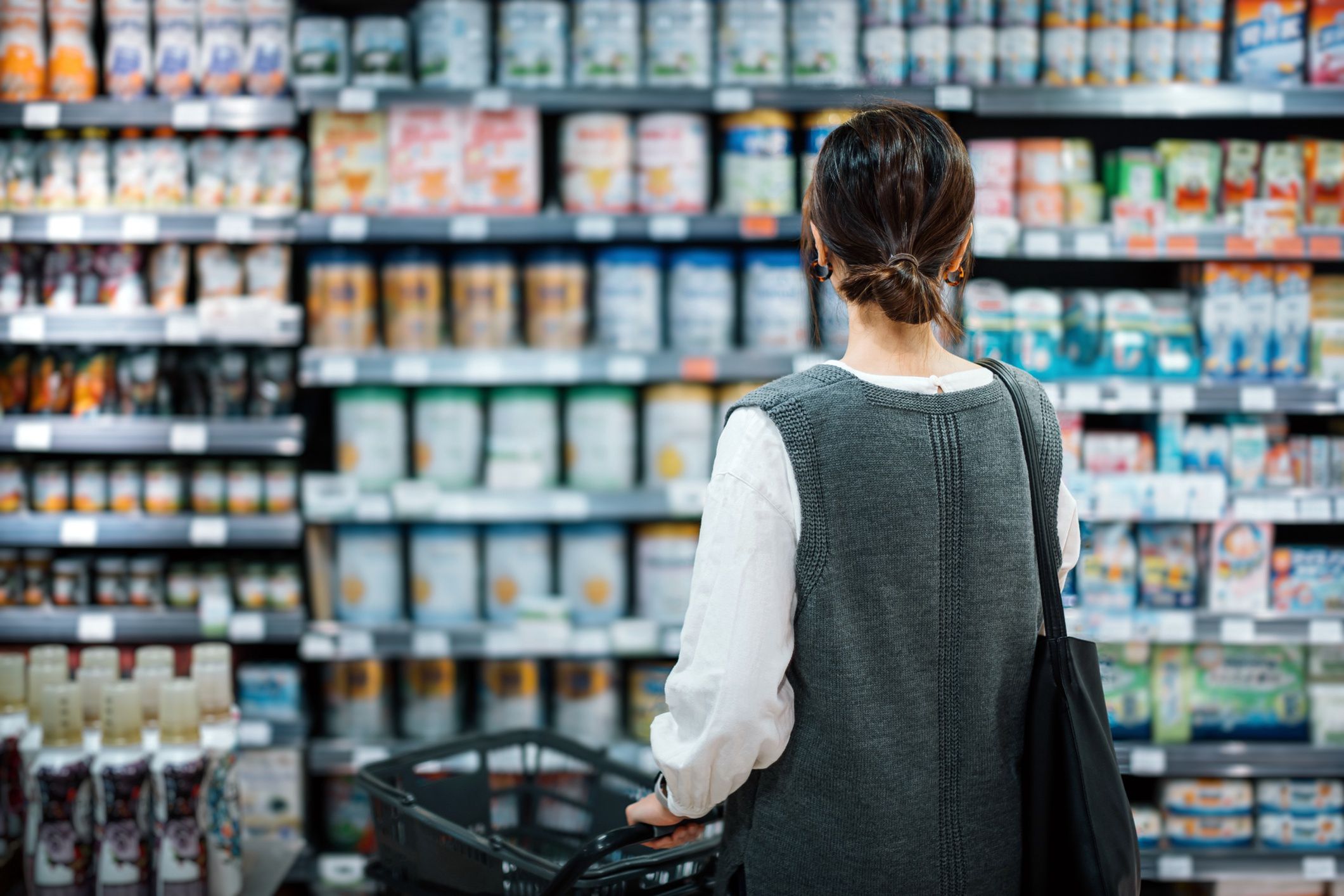 Rear view of young Asian mother with a shopping cart grocery shopping for baby products in a supermarket. She is standing in front of the baby product aisle and have no idea which product to choose from
Rear view of young Asian mother with a shopping cart grocery shopping for baby products in a supermarket. She is standing in front of the baby product aisle and have no idea which product to choose from
d3sign