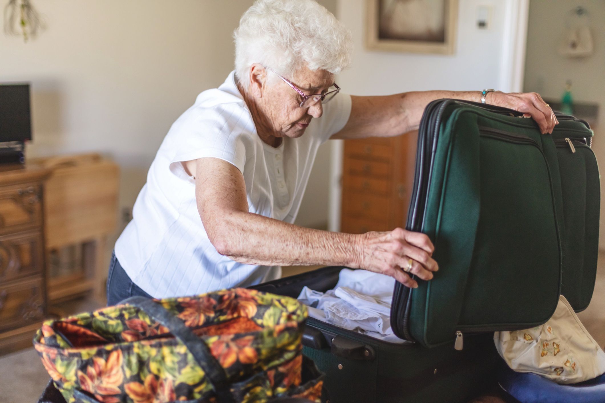 Elderly Woman at Home Packing Suitcases for Travel Photo Series
In Western Colorado Elderly Woman at Home Packing Suitcases Preparing for Travel Photo Series (Shot with Canon 5DS 50.6mp photos professionally retouched - Lightroom / Photoshop - original size 5792 x 8688 downsampled as needed for clarity and select focus used for dramatic effect)
eyecrave productions