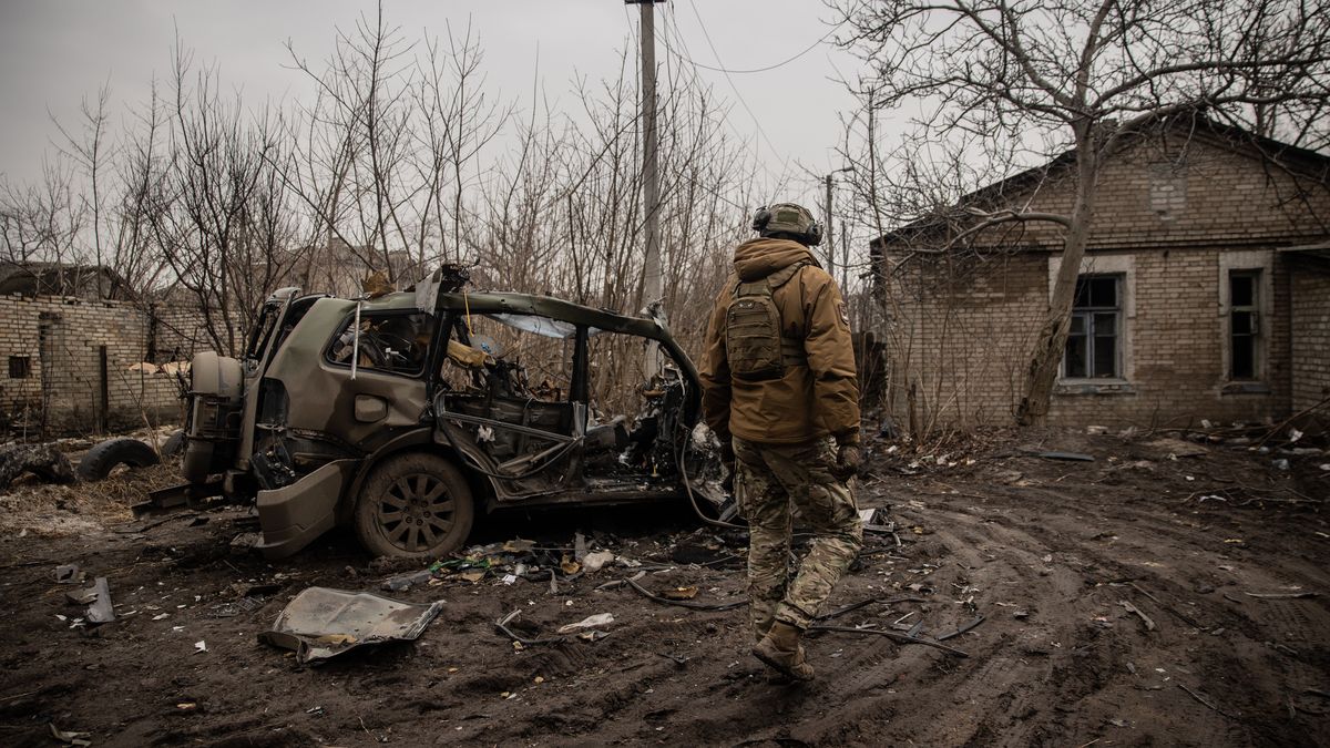 CHASIV YAR, UKRAINE - MARCH 16: A Ukrainian soldier walks near a destroyed house and car on March 16, 2024 in Chasiv Yar, Ukraine. A front line is a few kilometers from the city, on which Russian troops are dropping aerial bombs and shelling with artillery every day. Despite the danger, civilians remain in Chasiv Yar. (Photo by Roman Chop/Global Images Ukraine via Getty Images )
