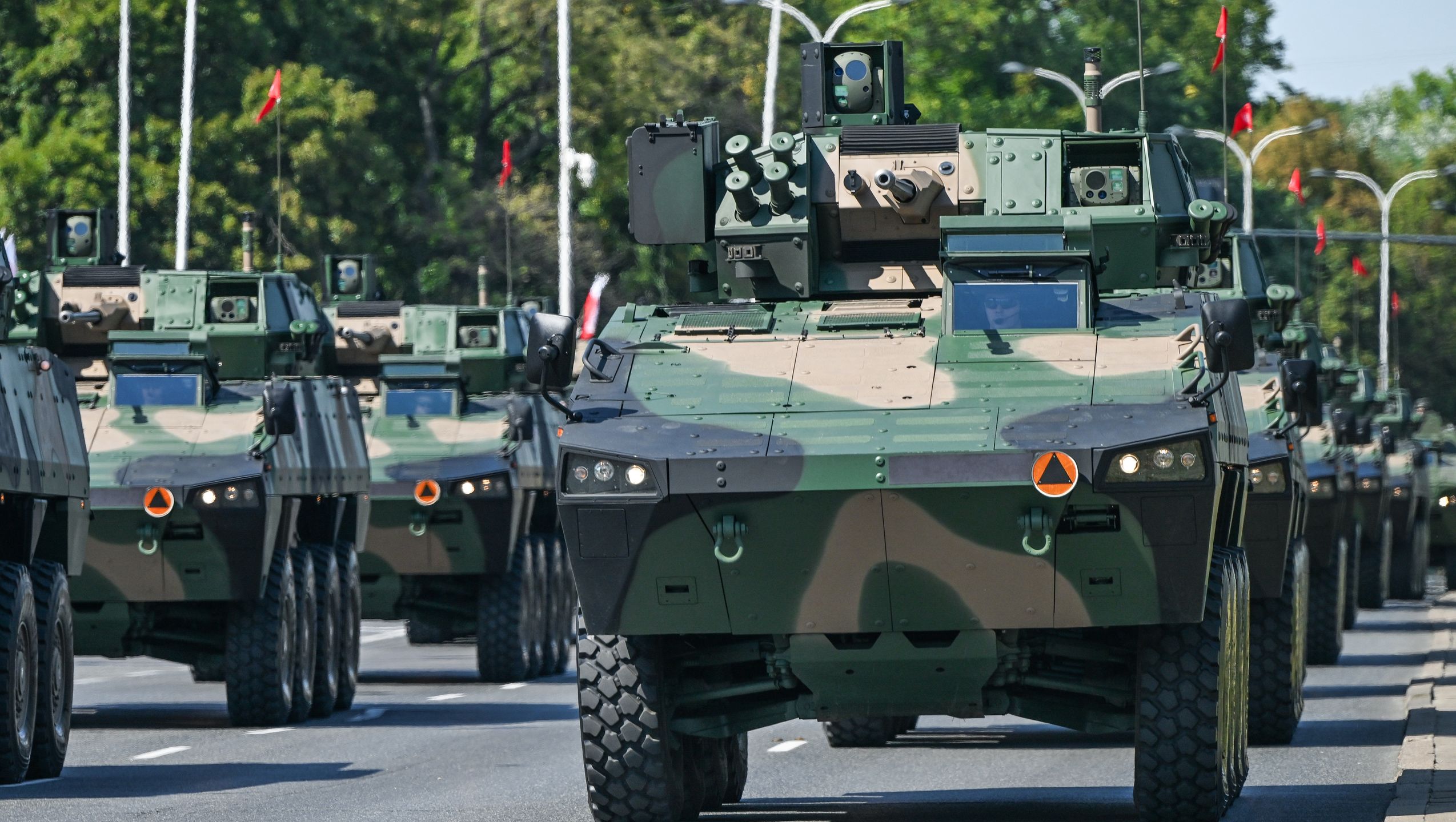 WARSAW, POLAND  AUGUST 15:A line of KTO Rosomak armored personnel carriers equipped with ZSSW-30 turrets seen during the Armed Forces Day parade, commemorating Poland's 1920 victory over the Soviet Red Army and marking the 105th anniversary of the Battle of Warsaw, in Warsaw, Poland, on August 15, 2025.The event featured more than 4,000 Polish troops, about 200 soldiers from allied NATO nations, around 300 military vehicles, and nearly 50 aircraft, making it the largest parade in the country's history. (Photo by Artur Widak/NurPhoto via Getty Images)