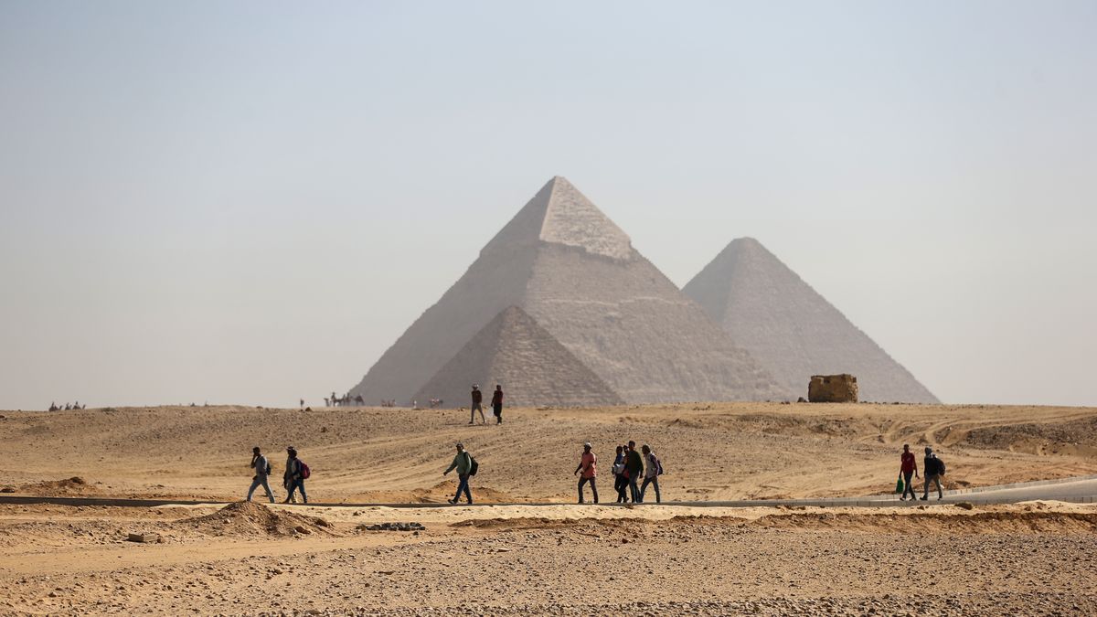 GIZA, EGYPT - MAY 24: Local and foreign runners participate in the "One Run" race at the Pyramids during the One Run race on May 24, 2025 near the Great Pyramid in Giza, Egypt. The race offered 1K, 5K, 10K, & 21K variations that passed by this wonder of the ancient world. (Photo by Ahmad Hasaballah/Getty Images)