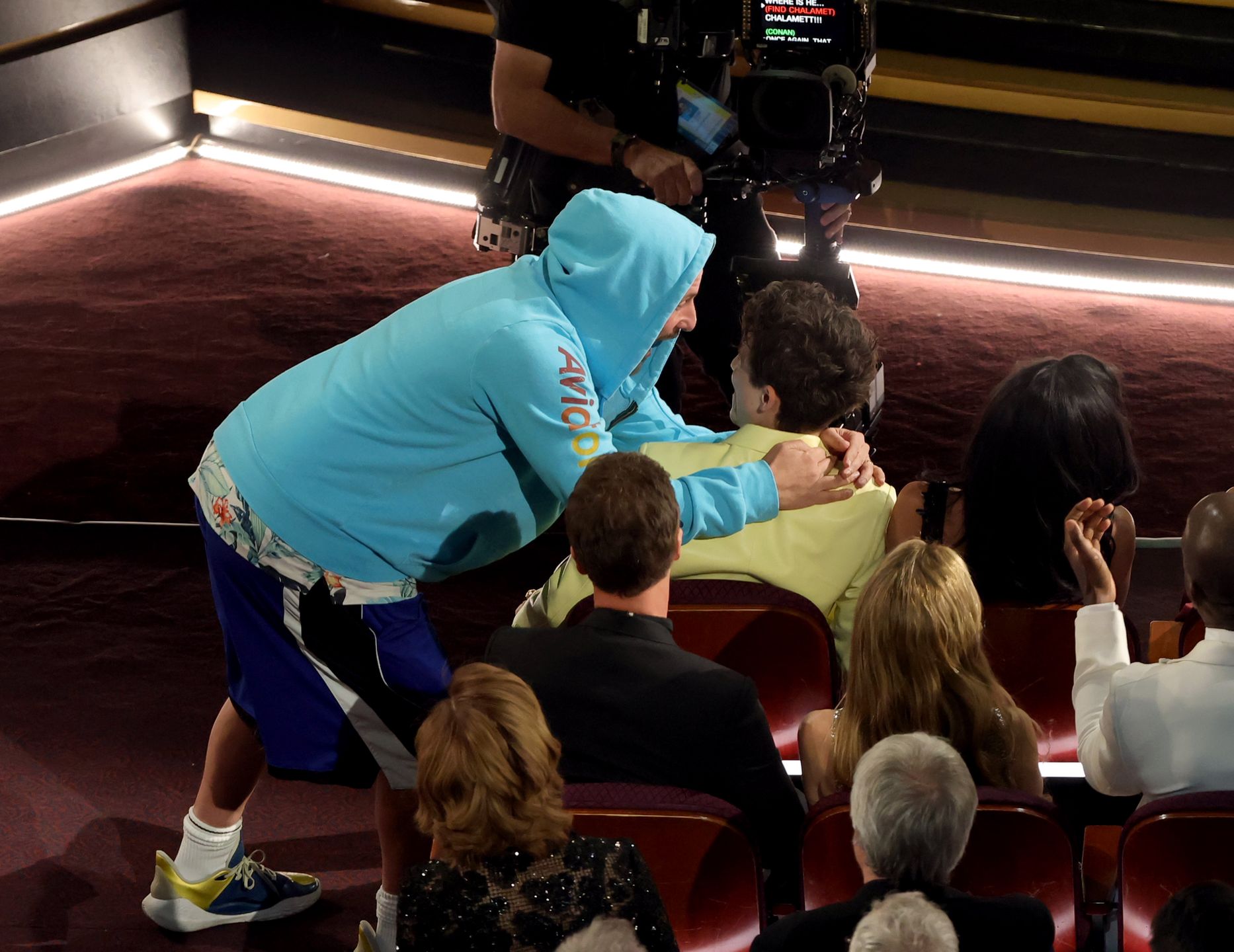 HOLLYWOOD, CALIFORNIA - MARCH 02: (L-R) Adam Sandler and Timothée Chalamet in the audience during the 97th Annual Oscars at Dolby Theatre on March 02, 2025 in Hollywood, California.  (Photo by Kevin Winter/Getty Images)