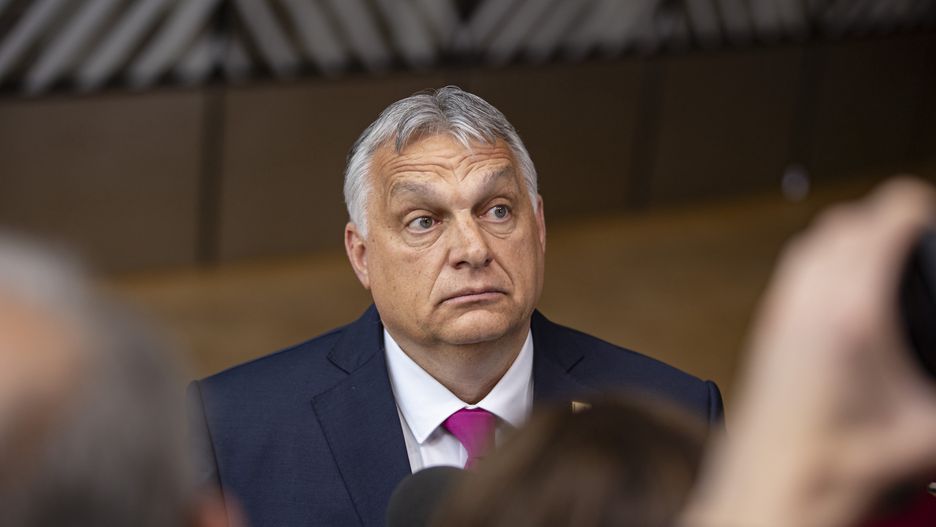 Viktor Orban Prime Minister of Hungary arrives at the special EU summit, walking next to the European flags behind the flag of Europe and talks to the media about the Russian sanctions. Special Meeting of the EU leaders, the European Council in Brussels, Belgium on May 30, 2022 (Photo by Nicolas Economou/NurPhoto via Getty Images)