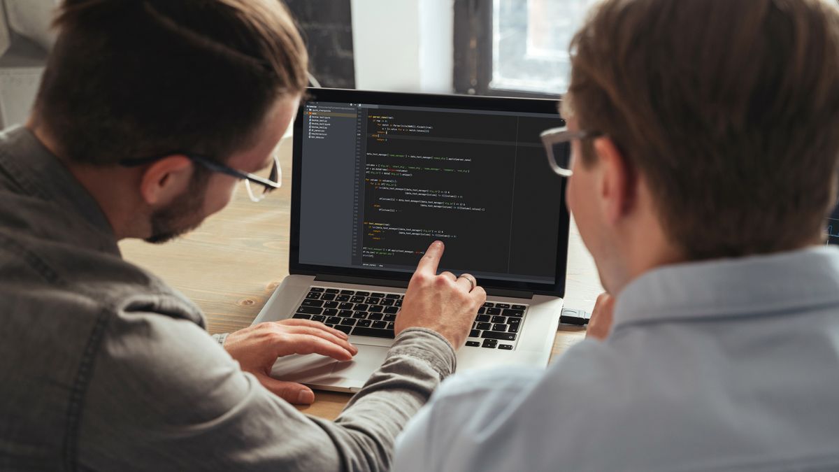 Over shoulder view of trader couch teaching another man basics of cryptocurrency investmentsIT specialist giving personal programming lesson to man. Over shoulder view of coders colleagues working on new project togethercoder, programming, education, IT, software engineer, developer, programmer, data science, coding, development, analysis, analytics, app, python, html, javascript, php, computer, screen, web, man, specialist, working, workspace, digital, technology, male, work, software, analyst, business, men, businessman, colleagues, collaboration, data, learning, people, code, engineer, lesson, teach, teacher, study, start-up, office, teaching, co-workers, restructuring
