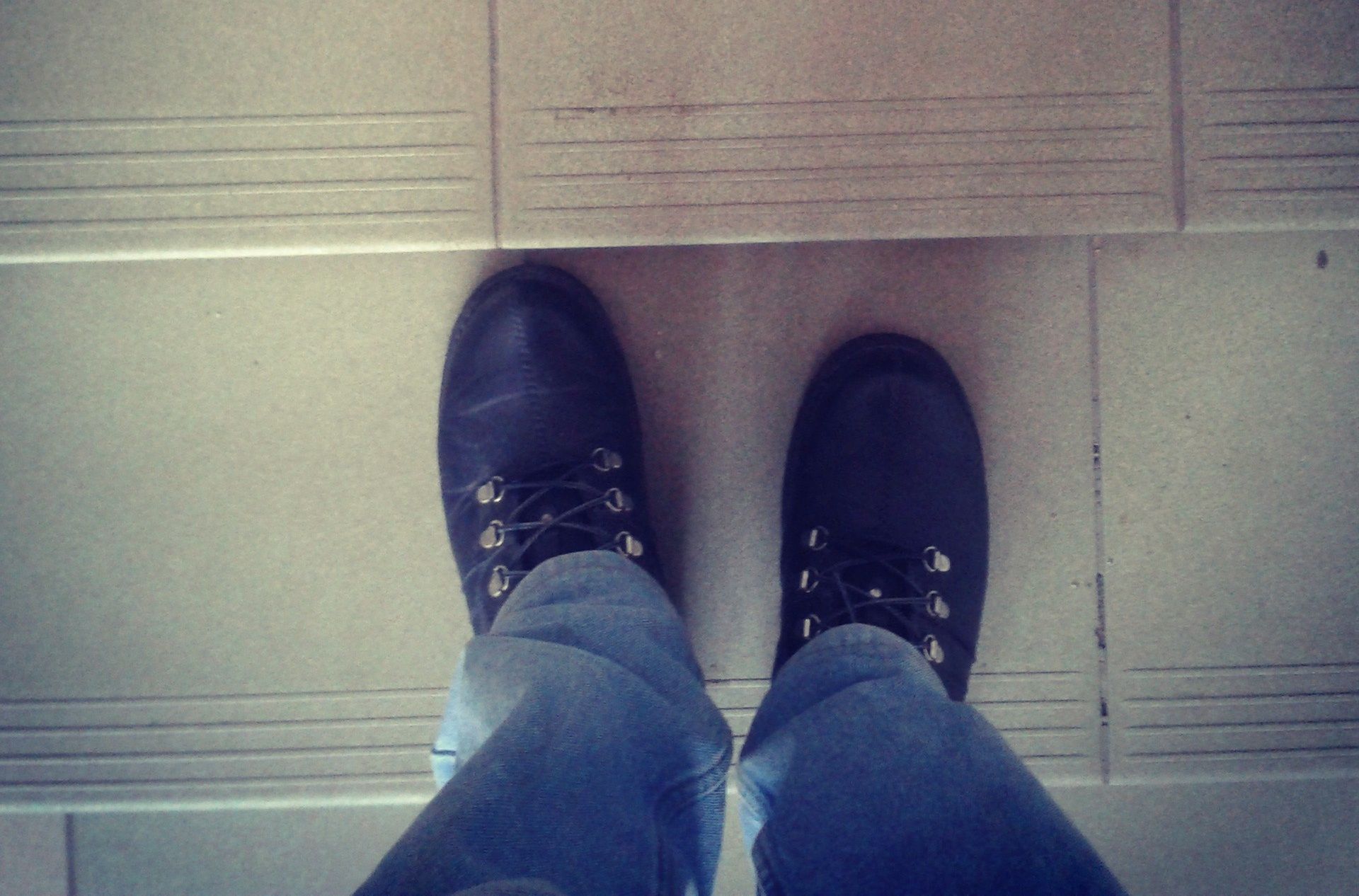 Feet on the stairs.Photographed with mobile phone.StraitelBlue, Boot, Brown, Cobblestone, Color Image, Copy Space, Day, Directly Above, Environment, Floor, Freshness, High Angle View, Human Foot, Human Leg, Ideas, Jeans, Looking Down, Men, MobileStock, Multi Colored, Outdoors, People Traveling, Personal Perspective, Shoe, Sidewalk, Square, Staircase, Standing, Steps, Stone, Summer, Toned Image, Travel, Unrecognizable Person, Waiting, Walking