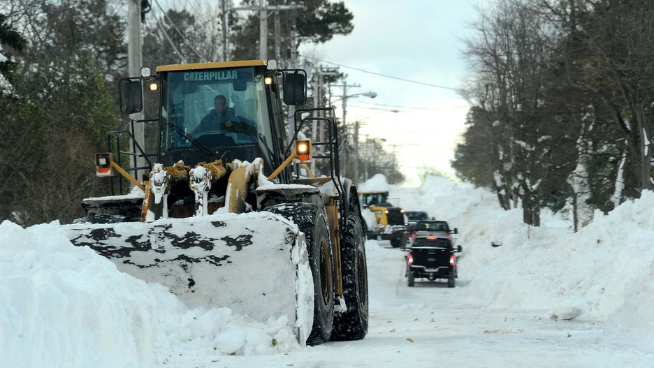 Temporary
HAMBURG, NY - November 20: A national Guard loader clears heavy snow from Lake Shore Road after an intense lake-effect snowstorm that impacted the area on November 20, 2022 in Hamburg, New York. Around Buffalo and the surrounding suburbs, the snowstorm resulted in up to six feet of accumulation and has been attributed to at least three deaths. The band of snow is expected to weaken overnight with milder temperatures expected.   John Normile/Getty Images/AFP (Photo by John Normile / GETTY IMAGES NORTH AMERICA / Getty Images via AFP)
JOHN NORMILE