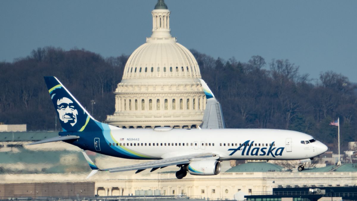 WASHINGTON - FEBRUARY 15: An Alaska Airlines Boeing 737-800 jet flies past the U.S. Capitol dome as it comes in for a landing at Washington Reagan National airport in Arlington, Va., on Thursday, February 15, 2024. (Bill Clark/CQ-Roll Call, Inc via Getty Images)