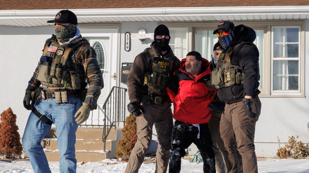 MINNESOTA, US - JANUARY 27: US Immigration and Customs Enforcement (ICE) agents detain a man outside of his home while conducting federal enforcement operations in St. Paul, Minnesota, United States on January 27, 2026. (Photo by Madison Thorn/Anadolu via Getty Images)