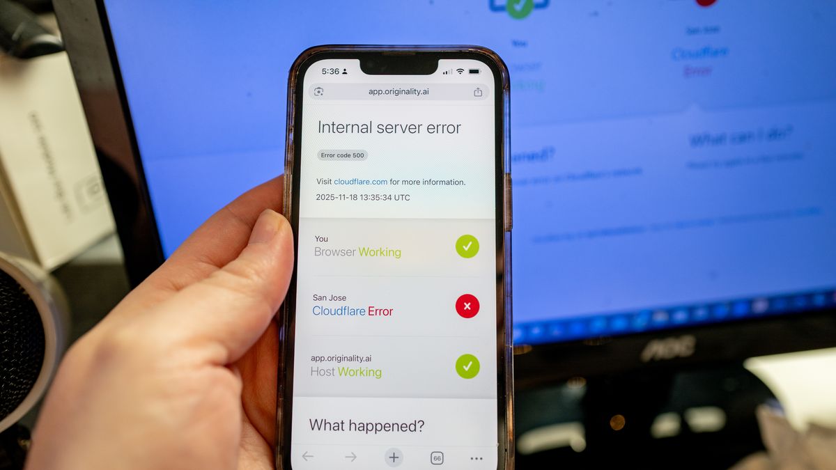 Person's handing hold an iPhone displaying a Cloudflare Error while attempting to access a webpage, during an outage of the Cloudflare service, Lafayette, California, November 18, 2025. (Photo by Smith Collection/Gado/Getty Images)