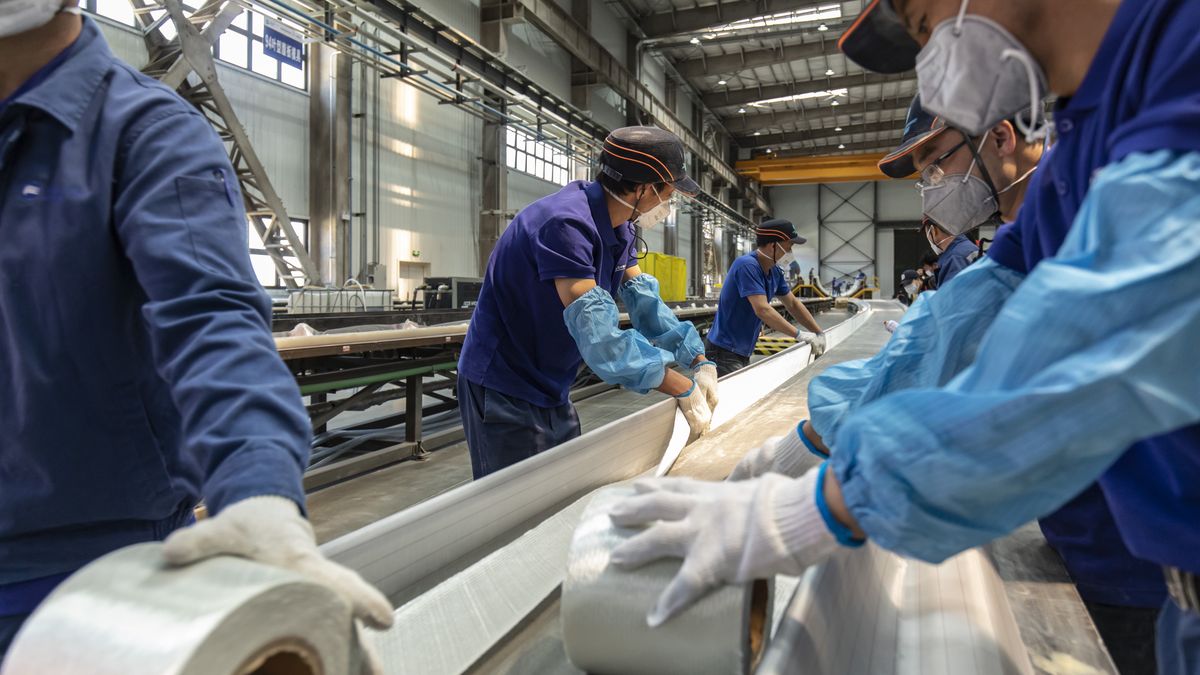 Wind turbine blades manufactured at a Ming Yang Smart Energy Group Ltd. plant in Baotou, Inner Mongolia, China, on Thursday, May 31, 2023. China will lift renewables capacity to about 3.9 terawatts by 2030, more than three times the amount in 2022, BNEF said in a report last week. Photographer: Qilai Shen/Bloomberg via Getty Images