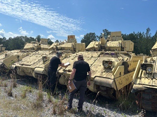 Greek delegation during an inspection of M2A2 Bradley vehicles