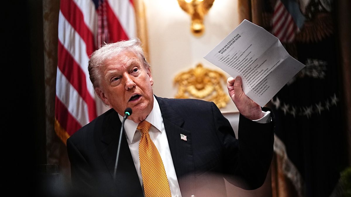 US President Donald Trump holds a list labelled "Bills We Could Pass With No Filibuster" during a meeting with Viktor Orban, Hungary's prime minister, not pictured, in the Cabinet Room of White House in Washington, DC, US, on Friday, Nov. 7, 2025. US President Donald Trump signaled an openness to exempting Hungary from sanctions on purchases of Russian energy as he hosted Prime Minister Viktor Orban. Photographer: Aaron Schwartz/CNP/Bloomberg via Getty Images