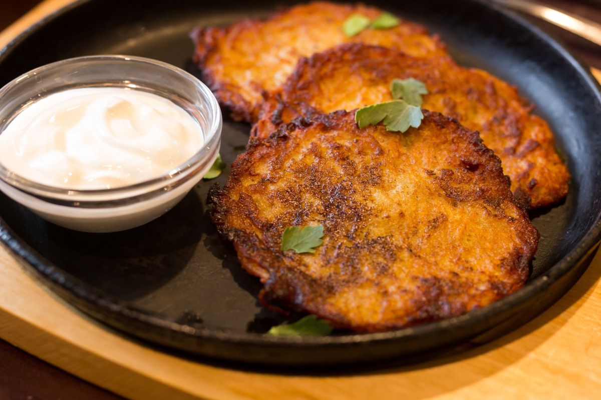 Potato pancakes served with garlic sauce