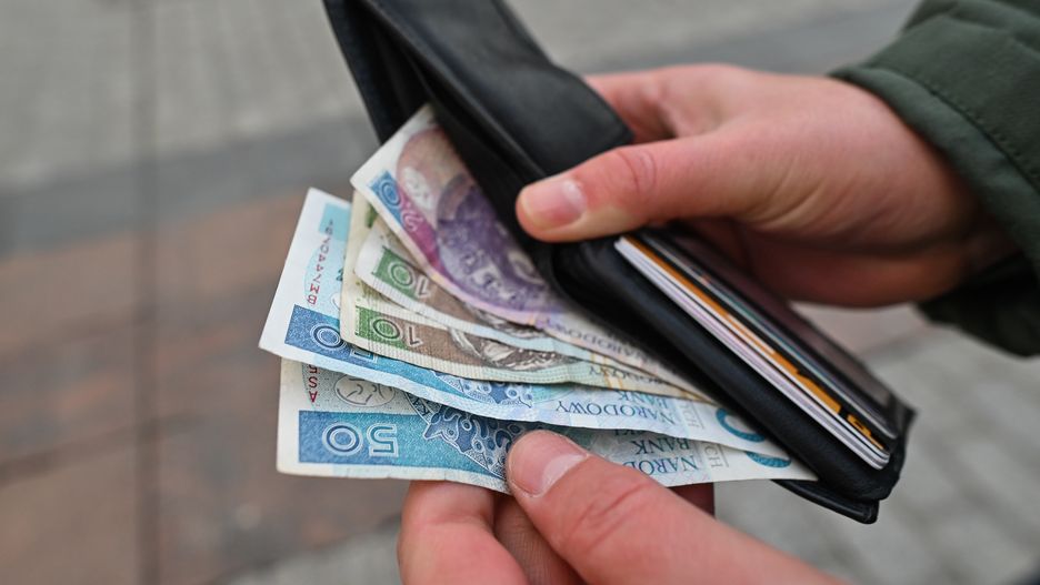 Poland Records Highest Inflation Rate Since 1996 In February 2023
KRAKOW, POLAND - MARCH 28, 2023: A person takes out Polish Zloty banknotes from a wallet, in Krakow, Poland, on March 28, 2023. In February 2023, Poland experienced a record-breaking inflation rate of 18.4%, the highest since December 1996 and in line with forecasts. However, experts predict a decrease in the coming months, with the possibility of single-digit inflation by the end of the year. Prices rose by 1.2% month-on-month, exceeding the forecasted 0.8% increase and the previous month's increase of 2.5%. The Central Statistical Office released this information in mid-March, with the last time inflation was this high being over 20 years ago. (Photo by Artur Widak/Anadolu Agency via Getty Images)
Anadolu
inflation, prices, raise