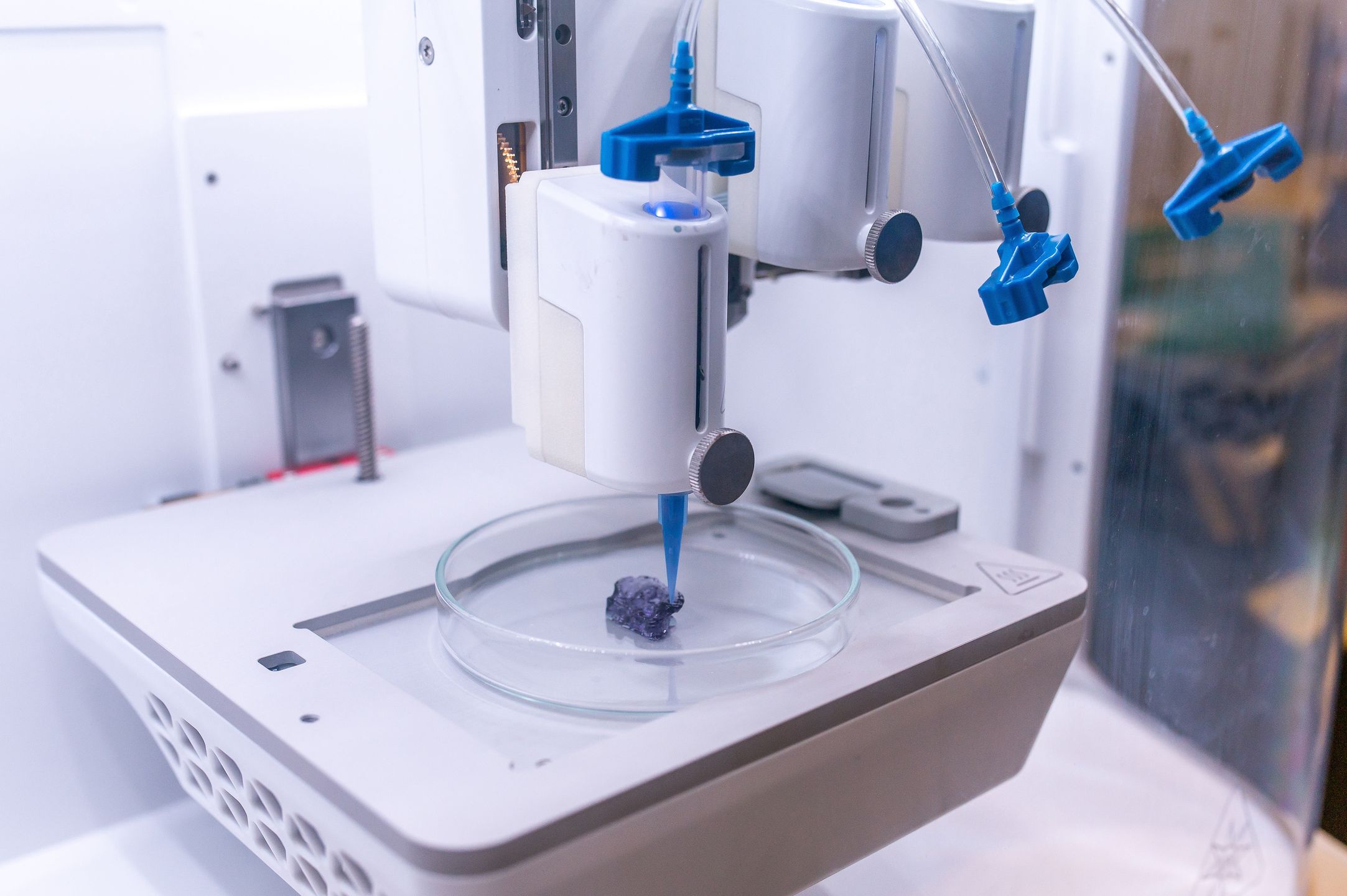 A 3D printing machine works on a test print of a scaled down ear in the Axolotl Biosciences lab at the University of Victoria in Victoria, British Columbia, Canada, on Wednesday, Sept. 7, 2022. The company's mission is to provide turn-key reagents, including bioinks, 3D tissue models, and consulting services in the field of 3D bioprinting to advance the field of tissue engineering and regenerative medicine. Photographer: James MacDonald/Bloomberg via Getty Images