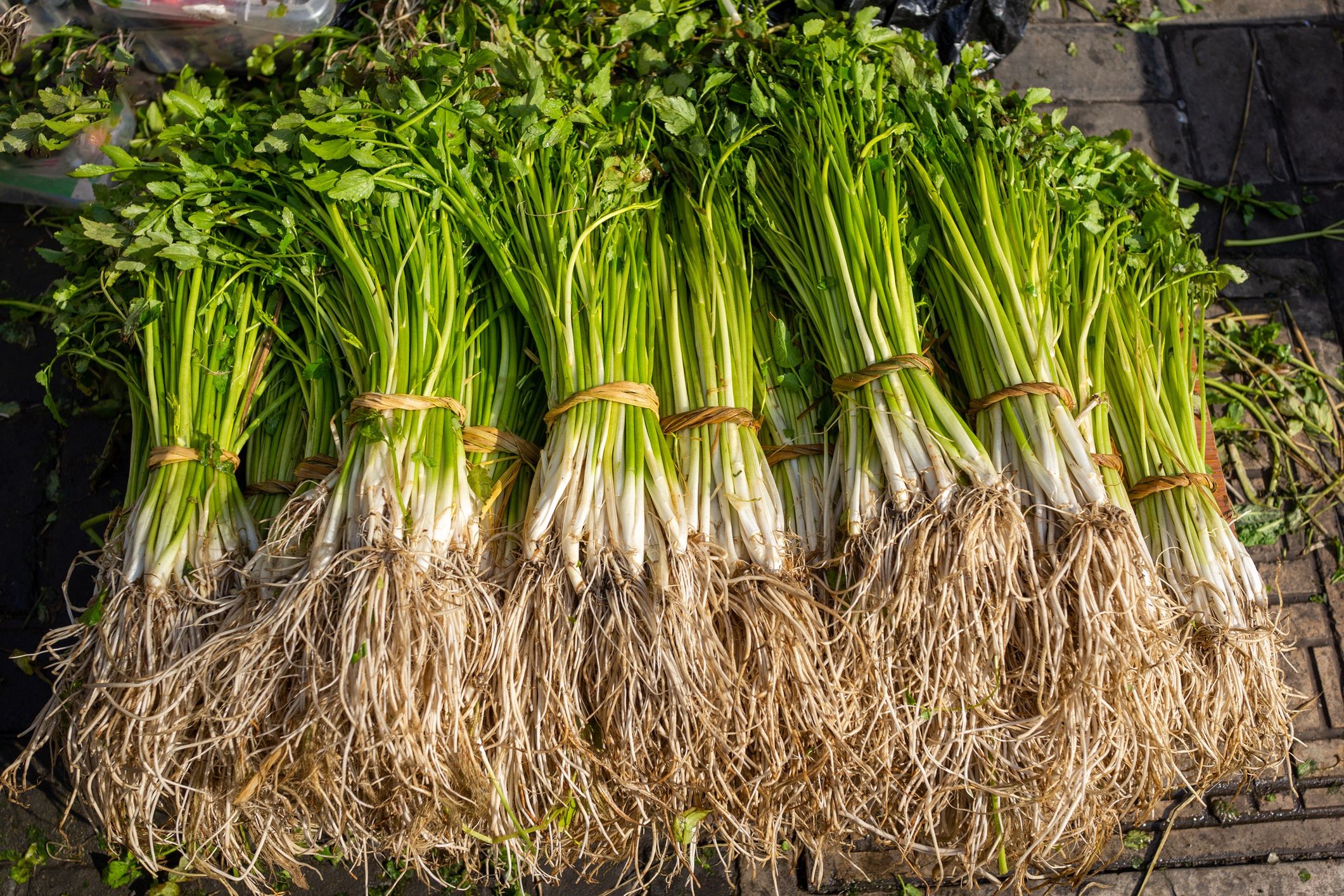 bunches of watercress selling at street market
wulingyun