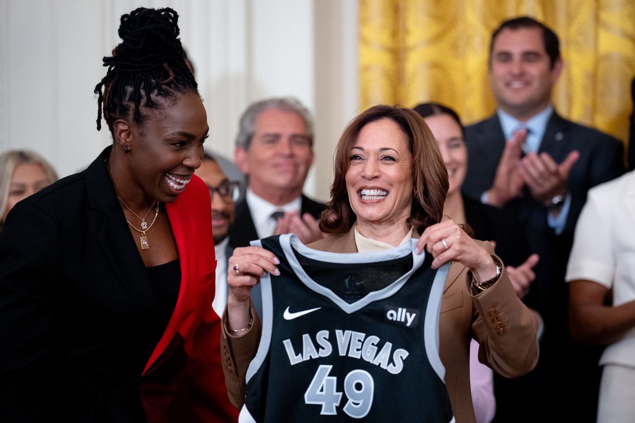 WASHINGTON, DC - MAY 9: Las Vegas Aces' guard Chelsea Gray (L) presents a jersey to U.S. Vice President Kamala Harris during a ceremony to celebrate the WNBA Champion Las Vegas Aces in the East Room of the White House on May 9, 2024 in Washington, DC. The Las Vegas Aces defeated the New York Liberty 70-69 in Game 4 of the 2023 WNBA Finals on October 18, 2023 at Barclays Center in Brooklyn, New York. (Photo by Andrew Harnik/Getty Images)