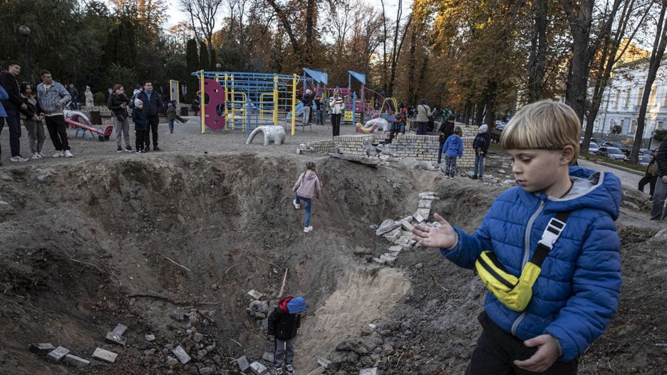 Missile hit Taras Shevchenko Park in Kyiv become play zone for children
KYIV, UKRAINE - OCTOBER 16: Ukrainian kids play on a crater, occurred after the Russian missile strikes, at the Taras Shevchenko Park in Kyiv, Ukraine on October 16, 2022. (Photo by Metin Aktas/Anadolu Agency via Getty Images)
Anadolu Agency
children, park, russia ukraine war, russian missile, taras shevchenko