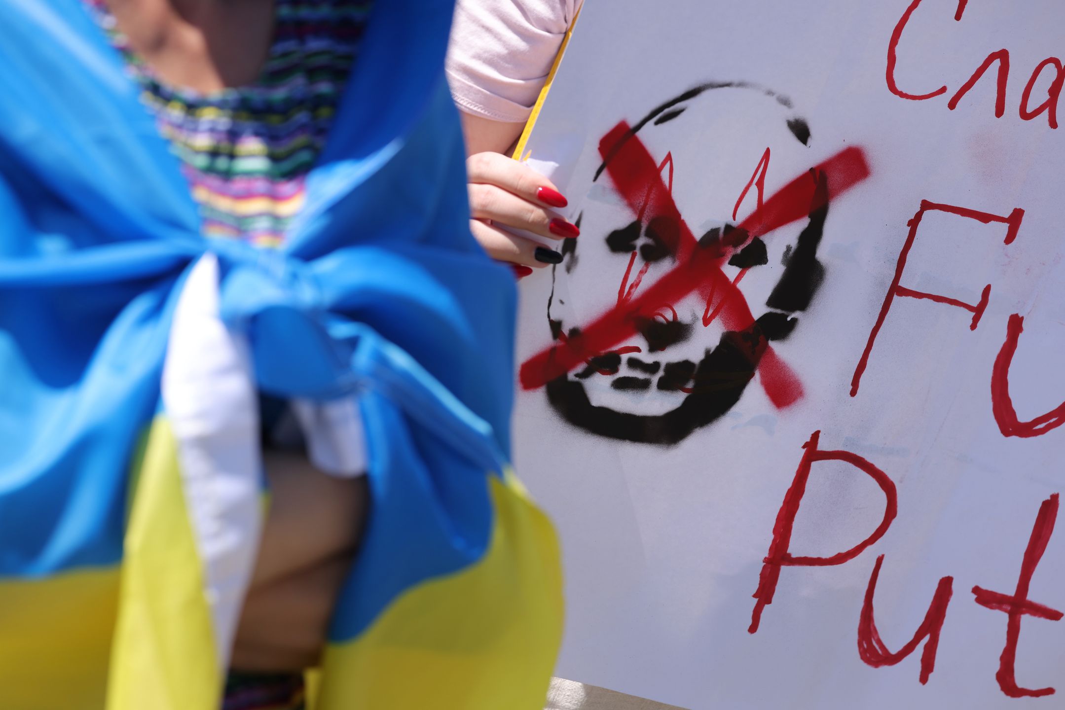 Ukrainians Demand Action On Europe's Promises As War Surpasses 100 Days
BERLIN, GERMANY - JUNE 05: A participant holds a sign denigrating Russian President Vladimir Putin during a protest gathering to demand Europe keep its promises towards supporting Ukraine on June 05, 2022 in Berlin, Germany. Approximately 100 people, mostly Ukrainians living in Berlin, protested too to demand that Germany deliver its promised heavy weaponry to Ukraine in support of Ukraine's current armed struggle against the ongoing Russian invasion. Russia's current war against Ukraine, which many had expected to conclude within weeks of its February 24 launch, recently surpassed 100 days and is now concentrated in the eastern Luhansk and Donetsk regions. (Photo by Sean Gallup/Getty Images)
Sean Gallup