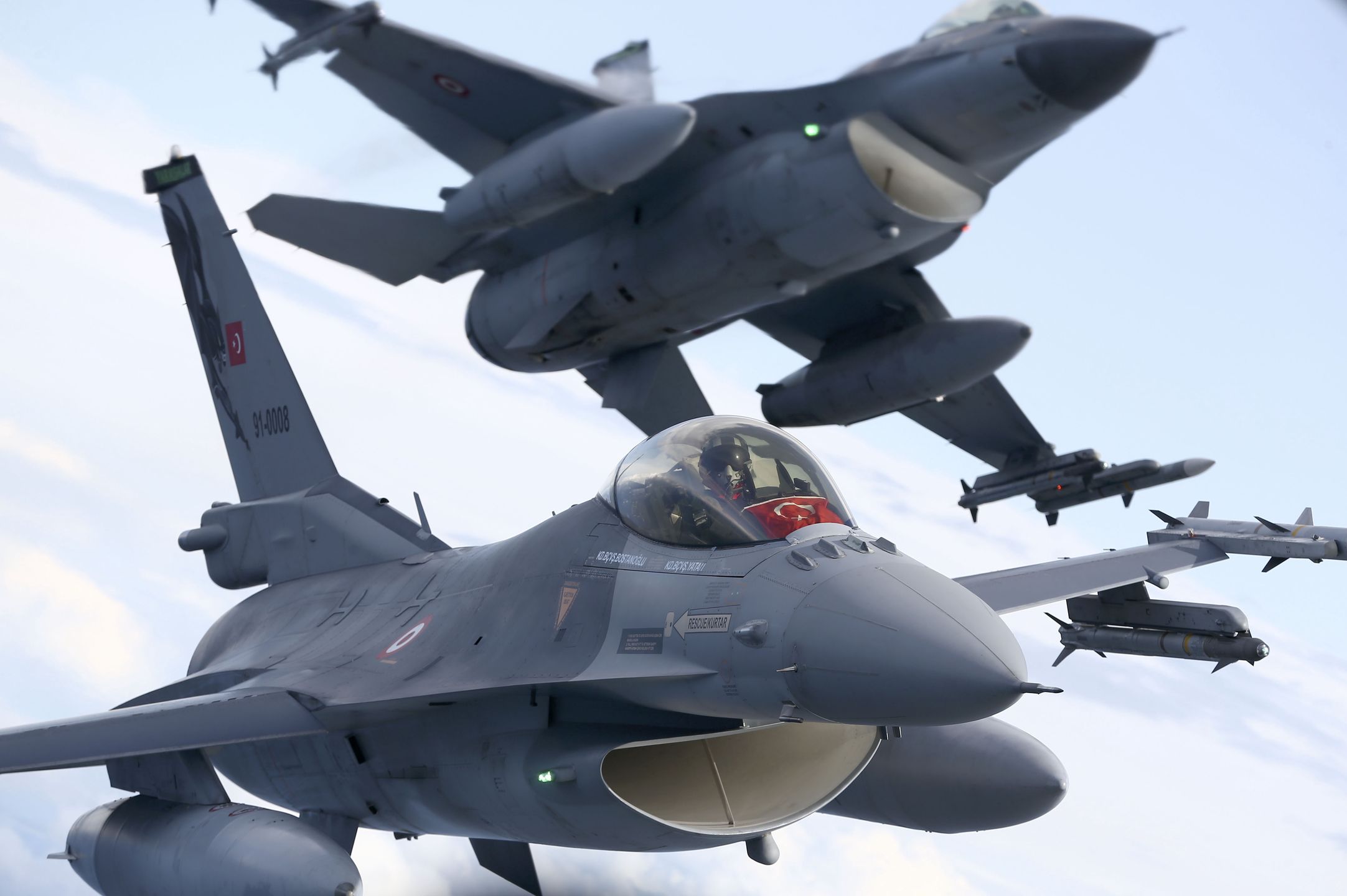 MALBORK, POLAND - AUGUST 27: Turkish F-16 fighter jet pilots fly by C-295M Casa military cargo plane of Poland and F-16 fighter jets as F-16 fighter jets of Turkish Air Forces serve in NATO's "Air Policing" mission at 22nd Air Base Command in Malbork, Poland on August 27, 2021. (Photo by Cuneyt Karadag/Anadolu Agency via Getty Images)