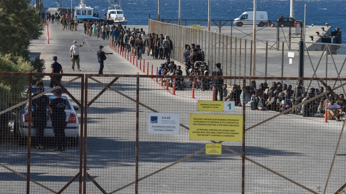 Migrants who arrive on board the bulk carrier Messinian Spire line up for processing at the Port of Lavrio, Greece, on July 10, 2025. The bulk carrier Messinian Spire carries 520 migrants from Libya who are rescued south of Crete. (Photo by Nicolas Koutsokostas/NurPhoto via Getty Images)