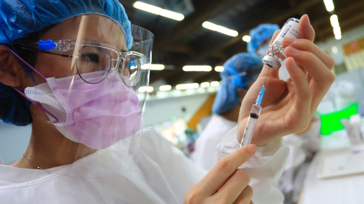 Medical workers prepare the Astra Zeneca vaccine, as the authority starts its mass vaccination programs, following a surge of domestic cases and deaths related to the Coronavirus, in New Taipei, Taiwan, on 15 June 2021. The 1.24 millions donated by Japan will be made available to six priority groups, including medical workers and the elderly. (Photo by Ceng Shou Yi/NurPhoto via Getty Images)