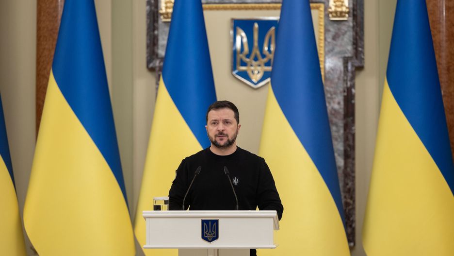 KYIV, UKRAINE - JANUARY 03: (----EDITORIAL USE ONLY - MANDATORY CREDIT - UKRAINIAN PRESIDENCY / HANDOUT' - NO MARKETING NO ADVERTISING CAMPAIGNS - DISTRIBUTED AS A SERVICE TO CLIENTS----) Ukrainian President Volodymyr Zelenskyy during the event where certificates to the apartment were given to the flat allocated to the soldiers who participated in the Russia-Ukraine war and the families of fallen Heroes at the Mariinsky Palace in Kyiv, Ukraine on January 03, 2023. As part of the Head of State's initiative to provide housing for the soldiers of the Heroes of Ukraine, Zelenskyy presented certificates of obtaining apartments to the Heroes of Ukraine and the family members of the fallen soldiers who received this title posthumously. During the event, those present honored the memory of all Ukrainian soldiers, all citizens of Ukraine, who gave their lives for the preservation of the state, with a moment of silence. (Photo by Ukrainian Presidency / Handout/Anadolu via Getty Images)
