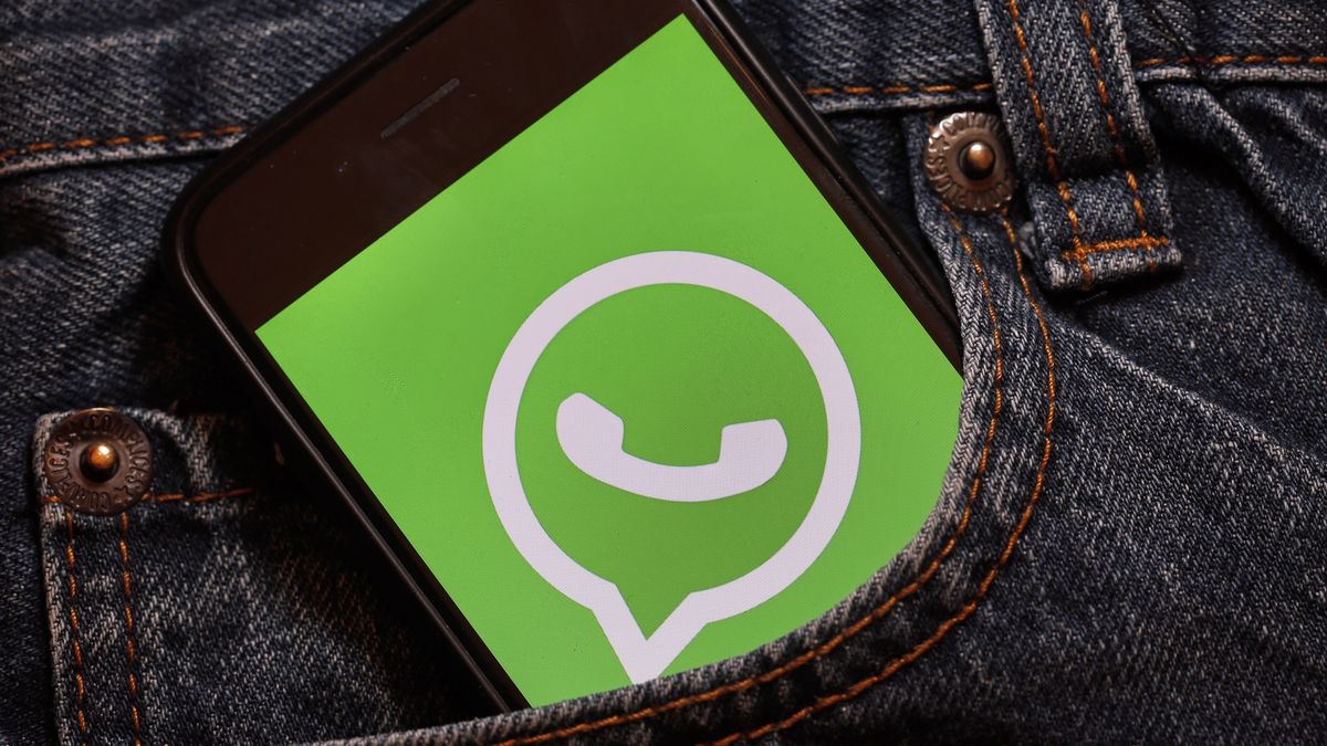 PARIS, FRANCE - DECEMBER 10: In this photo illustration, the WhatsApp logo is displayed in the pocket of a pair of trousers on December 10, 2019 in Paris, France. The WhatsApp instant messenger service will stop working on millions of phones in the next couple of months as the company withdraws support for some older mobile platforms. From February 1, 2020, any iPhone running iOS 8 or older will no longer be supported, along with any Android device running version 2.3.7 or older. (Photo by Chesnot/Getty Images)