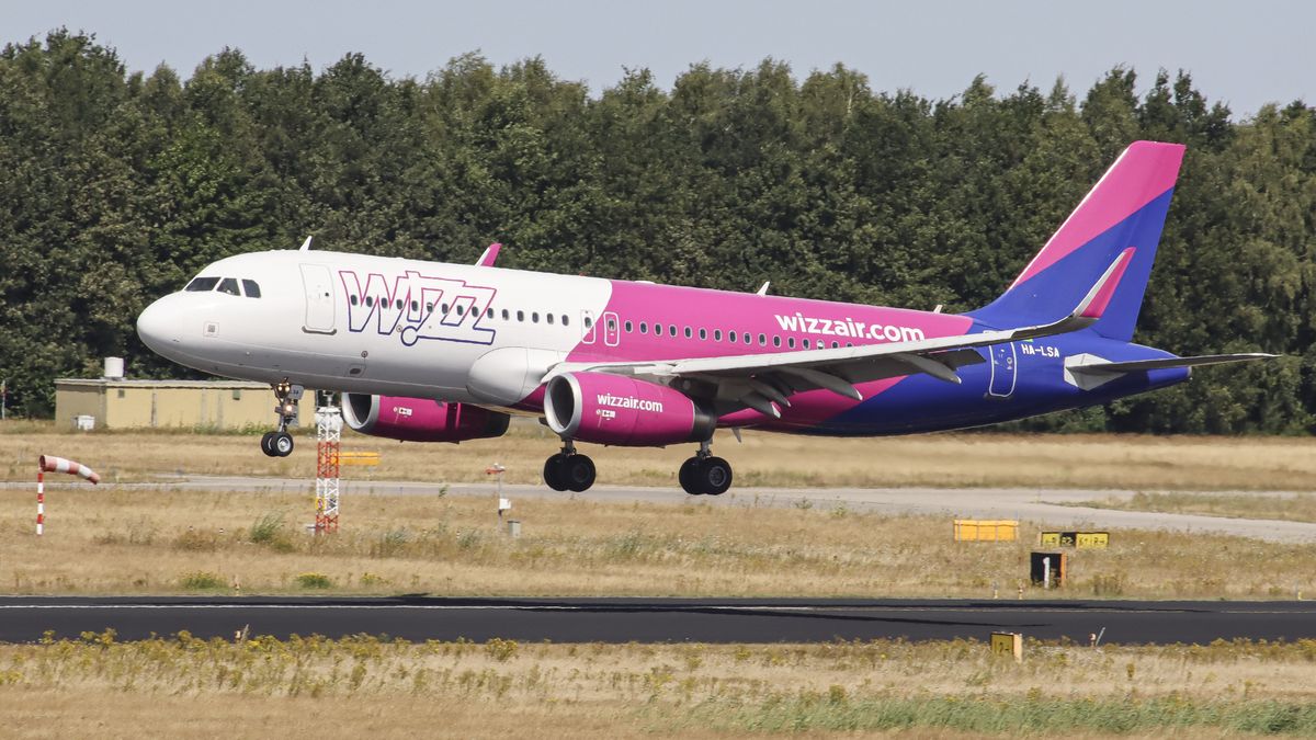 Wizz Air Airbus A320 aircraft as seen flying, landing and taxiing in Eindhoven arriving from Vilnius with flight number W68025 . The Airbus A320 airplane of the Hungarian ultra low cost airline carrier WizzAir has the registration HA-LSA. During the summer of 2022 the European Aviation industry is facing long delays, cancellations and travel chaos mostly because of staff shortages at the airports after the Covid-19 Coronavirus pandemic era, air travel has faced increased demand. Eindhoven, the Netherlands on August 9, 2022  (Photo by Nicolas Economou/NurPhoto via Getty Images)