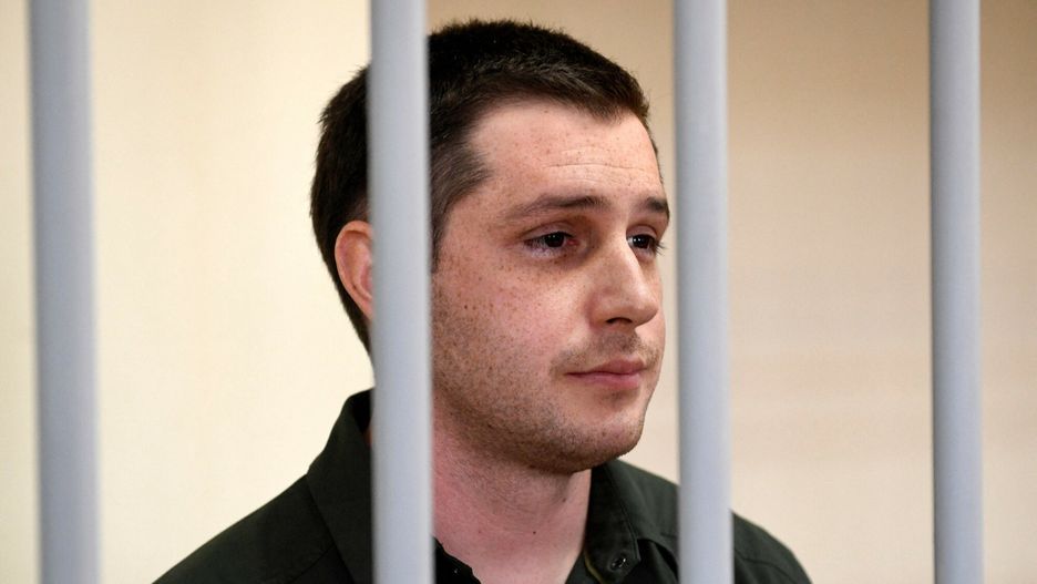 Temporary(FILES) In this file photo taken on March 11, 2020 US ex-marine Trevor Reed, charged with attacking police, stands inside a defendants' cage during a court hearing in Moscow. - Moscow said on April 27, 2022 it has exchanged former US marine Trevor Reed, jailed in Russia for assaulting police, for Russian pilot Konstantin Yaroshenko, who was convicted of drug smuggling in the United States. (Photo by Alexander NEMENOV / AFP)ALEXANDER NEMENOV