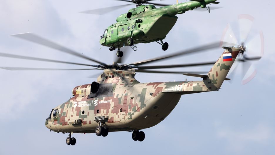 MOSCOW REGION, RUSSIA - AUGUST 26, 2019: Mil Mi-26T2V (L) and Mi-17 transport helicopters perform a flight during preparations for the MAKS-2019 International Aviation and Space Salon in the town of Zhukovsky, Moscow Region. Marina Lystseva/TASS (Photo by Marina Lystseva\TASS via Getty Images)