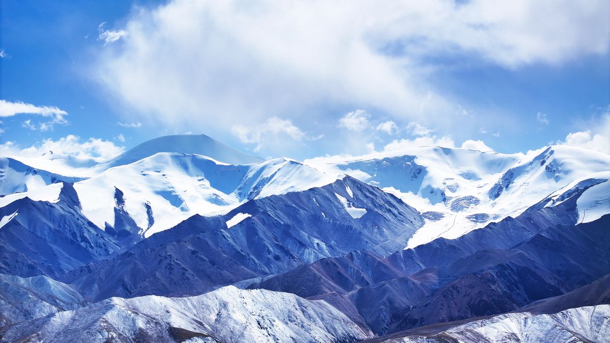 GOLMUD, CHINA - OCTOBER 15: Aerial view of snow-capped Yuzhu Peak of the eastern part of the Kunlun Mountains on October 15, 2024 in Golmud, Haixi Mongolian and Tibetan Autonomous Prefecture, Qinghai Province of China. (Photo by VCG/VCG via Getty Images)