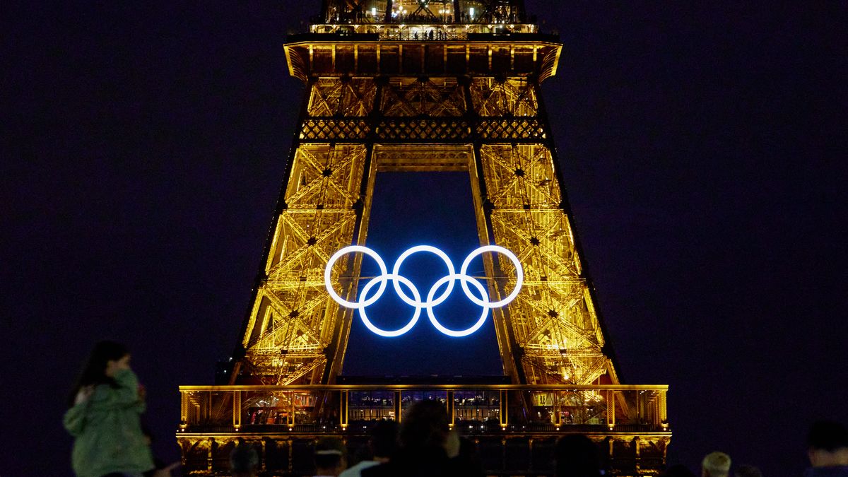 The Olympic rings are displayed on the Eiffel Tower at night between the Paris 2024 Olympic and Paralympic Games, in Paris on August 19, 2024. (Photo by Adnan Farzat/NurPhoto via Getty Images)