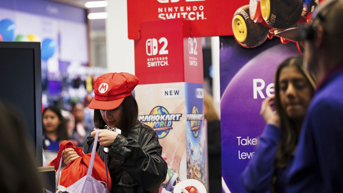 A customer leaves with purchases during the sales launch of the Nintendo Switch 2 gaming console at the Currys Plc store on Oxford Street in London, UK, on Wednesday, June 4, 2025. Nintendo is opening sales of the Switch 2 today, and shoppers are scouting out stores to increase their chances of getting a hold of the $450 console. Photographer: Jose Sarmento Matos/Bloomberg via Getty Images