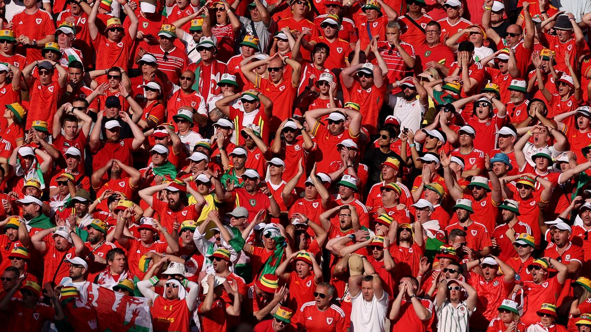 DOHA, QATAR - NOVEMBER 25: Wales fans react to a near miss during the FIFA World Cup Qatar 2022 Group B match between Wales and IR Iran at Ahmad Bin Ali Stadium on November 25, 2022 in Doha, Qatar. (Photo by Richard Heathcote/Getty Images)