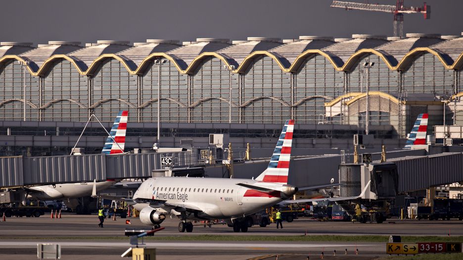 An American Airlines Group Inc. Embraer 175 plane taxis at Reagan National Airport (DCA) in Arlington, Virginia, U.S., on Monday, April 6, 2020. U.S. airlines are applying for federal aid to shore up their finances as passengers stay home amid the coronavirus pandemic. Photographer: Andrew Harrer/Bloomberg via Getty Images