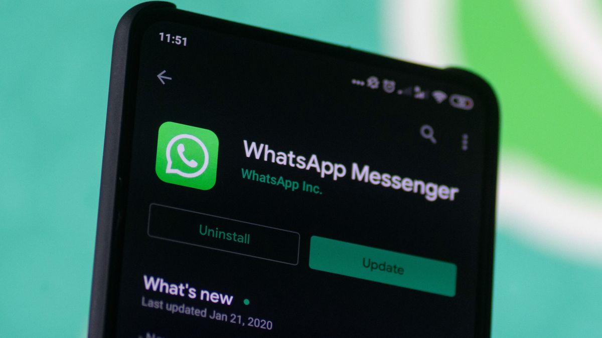 WhatsApp logo displayed on a phone screen, smartphone and keyboard are seen in this multiple exposure illustration. WhatsApp Messenger is a multiplatform mobile application that provides an encrypted instant messaging system belonging to Facebook, photo taken in Amsterdam, Netherlands on January 28, 2020 (Photo illustration by Nicolas Economou/NurPhoto via Getty Images)