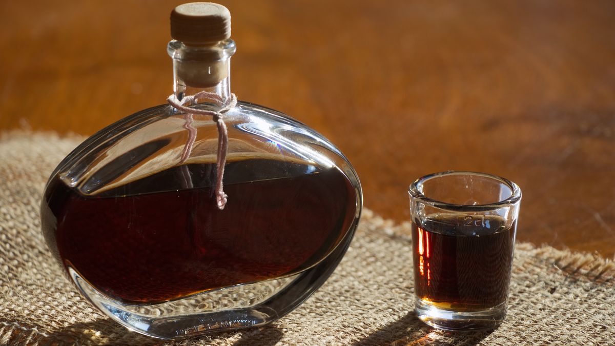 Walnut liquor in bottle on a wooden table
Homemade alcohol drink.
Zbynek Pospisil
strong alcohol, walnut liquor