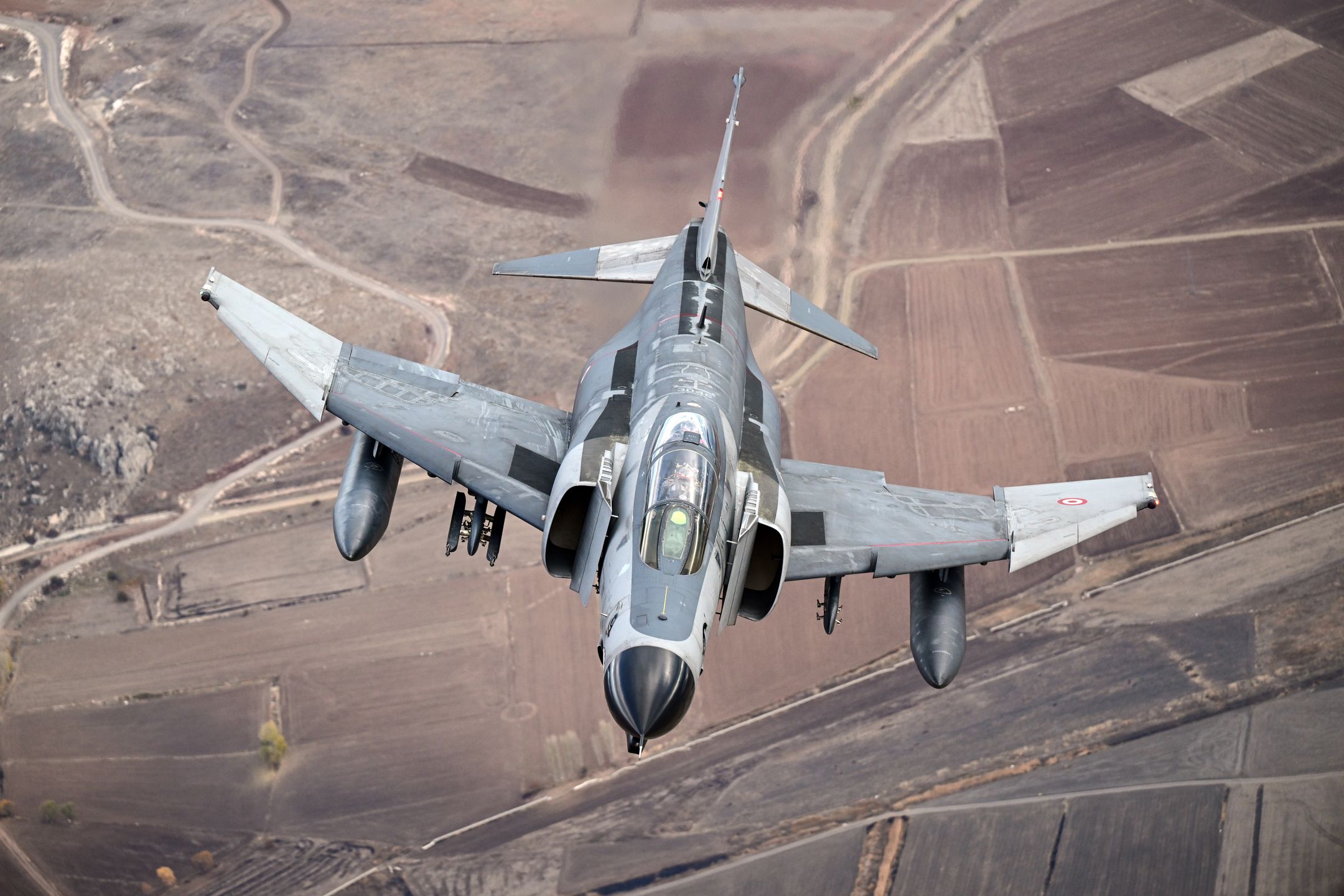 ESKISEHIR, TURKIYE - NOVEMBER 15: F-4E Phantom II, one with a Turkish flag take part in training flight to commemorate 50 years of service in the Turkish Air Force in Eskisehir, Turkiye on November 15, 2024. (Photo by Ali Atmaca/Anadolu via Getty Images)