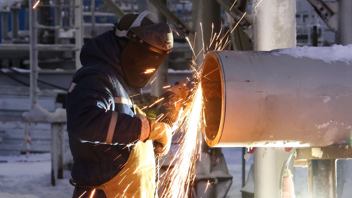 MURMANSK REGION, RUSSIA - NOVEMBER 30, 2021: A welder is at work at the Utrenneye field, the resource base for Novatek's Arctic LNG 2 project. The LNG Construction Centre (TsSKMS) produces gravity-based structures, large modules and gas liquefaction trains on gravity-based structures. The center is the key element of the Russia's LNG equipment production industry. Stanislav Krasilnikov/TASS (Photo by Stanislav Krasilnikov\TASS via Getty Images)