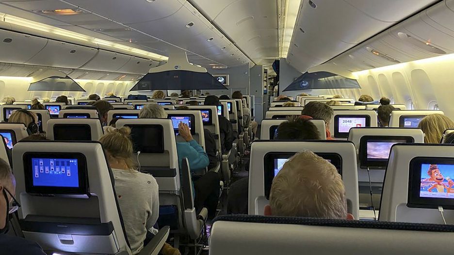TemporaryPassengers sit in their seats aboard KLM Flight 598 on the tarmac at Schipol airport in Amsterdam after it landed from Cape Town, South Africa on Friday Nov. 26, 2021. The flight was held on the edge of the runway at Schiphol airport for four hours pending special testing because of the new variant Advisers to the World Health Organization are holding a special session Friday to flesh out information about a worrying new variant of the coronavirus that has emerged in South Africa, though its impact on COVID-19 vaccines may not be known for weeks. (UGC via AP)Third Party
