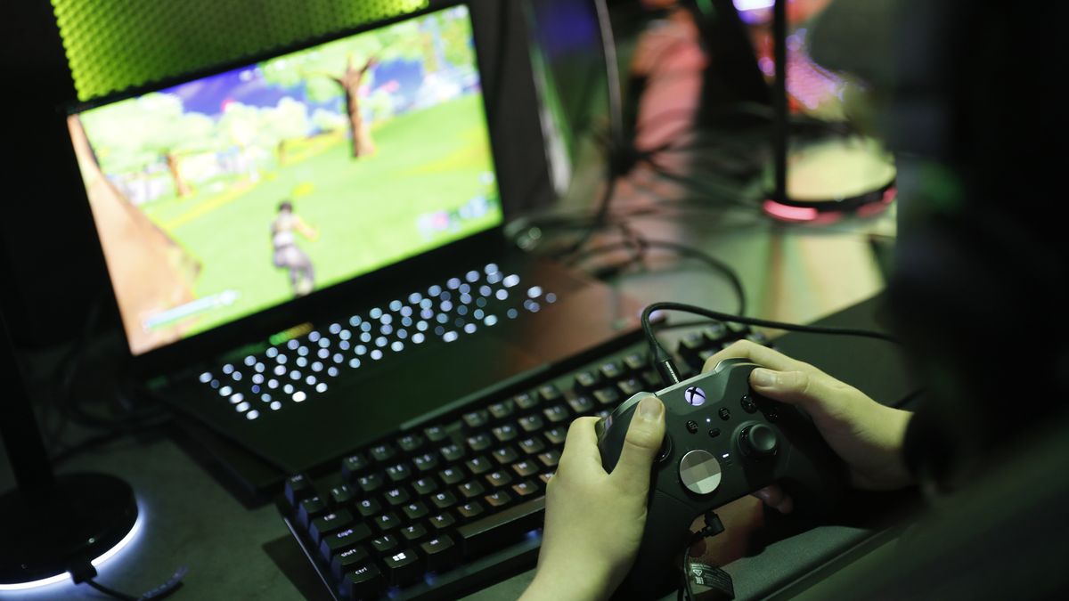 LONDON, ENGLAND - APRIL 28: Someone plays Fortnite at the launch of Hamleys new immersive & interactive gaming space on April 28, 2022 in London, England. (Photo by Tristan Fewings/Getty Images for Hamleys)