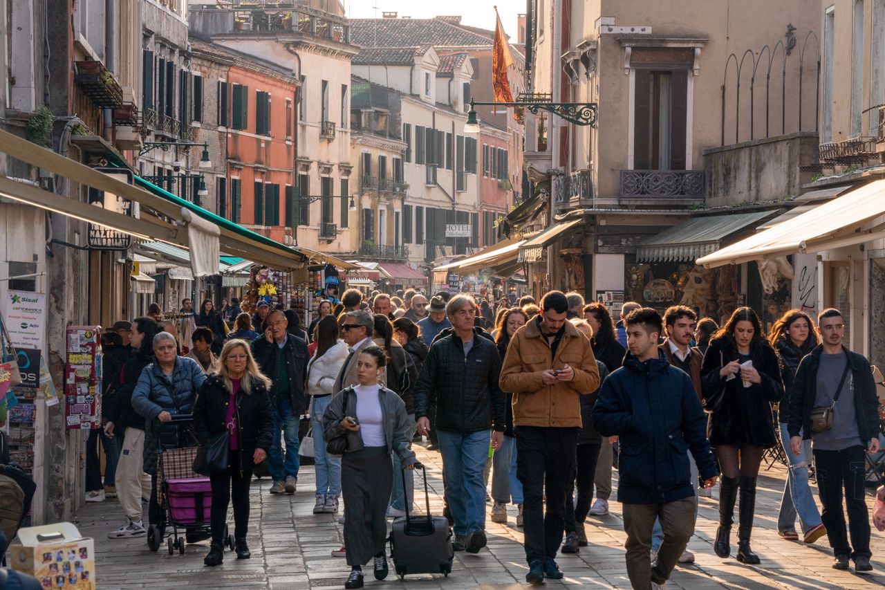 Tourists line a street in Venice, Italy, on Saturday, March 16, 2024. Venice collected 37 million in overnight tourist taxes in 2023, with hotels charging guests anywhere between 1 and 5. Photographer: Nathan Laine/Bloomberg via Getty Images: Nathan Laine/Bloomberg via Getty Images