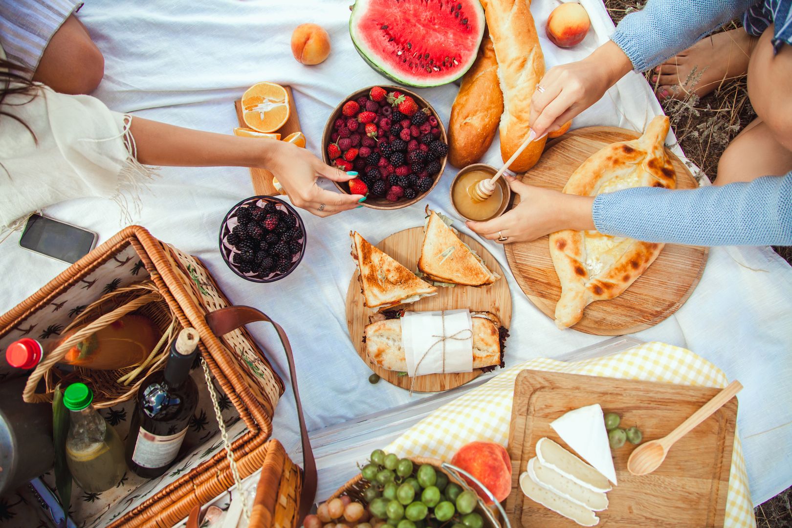 Picnic set with fruit, cheese, toast, honey, wine with a wicker basket and a blanket. Beautiful summer background with girl and products on nature
picnic, summer, fun, happiness, young, beautiful, lifestyle, women, girls, leisure, vacation, people, outdoor, girlfriends, alcohol, bottles, celebrating, celebration, holidays, joy, lemonade, sitting, peaches, grapes, watermelon, blackberries, toast, wine, blanket, cheese, honey, cucumbers, raspberries, orange, baguette, pretty, smiling, two, basket, bread, food, nature, girl, park, female, drinks, females