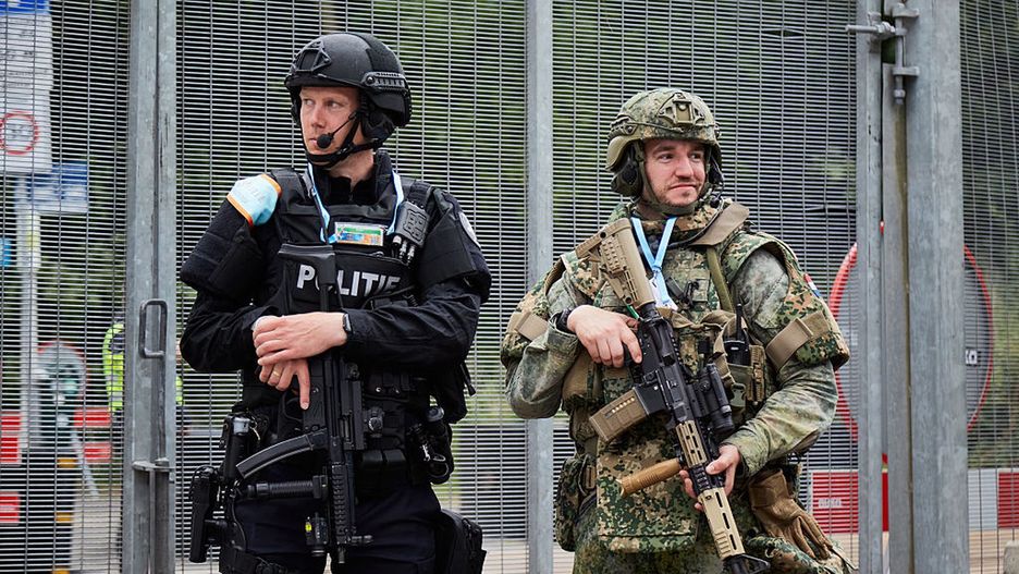 NATO Leaders Attend 2025 Summit In The Hague
THE HAGUE, NETHERLANDS - JUNE 24: A Dutch police officer (L) and a Dutch soldier (R) stand guard at the NATO summit on June 24, 2025 in The Hague, Netherlands. This year's NATO summit, which brings together heads of state and government from across the military alliance, is being held in the Netherlands for the first time. Among other matters, members are to approve a new defense investment plan that raises target for defense spending to 5% of GDP. (Photo by Pierre Crom/Getty Images)
Pierre Crom