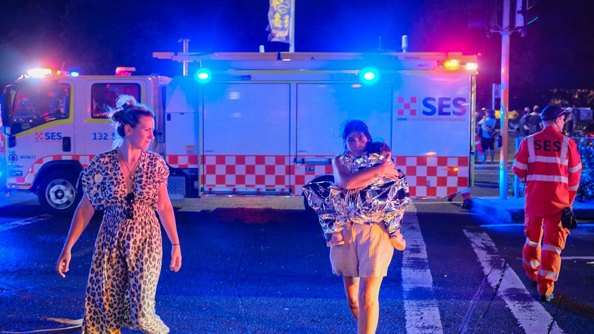 Shots Fired At Sydney's Bondi Beach
SYDNEY, AUSTRALIA - DECEMBER 14: A member of the public leaves the scene with her child, who is covered in an emergency blanket, after a shooting at Bondi Beach on December 14, 2025 in Sydney, Australia. Two gunmen dressed in black fired several shots at Sydney's world-famous Bondi Beach, causing at least 10 injuries and three deaths, and setting off mass panic on a Sunday evening. (Photo by George Chan/Getty Images)
George Chan