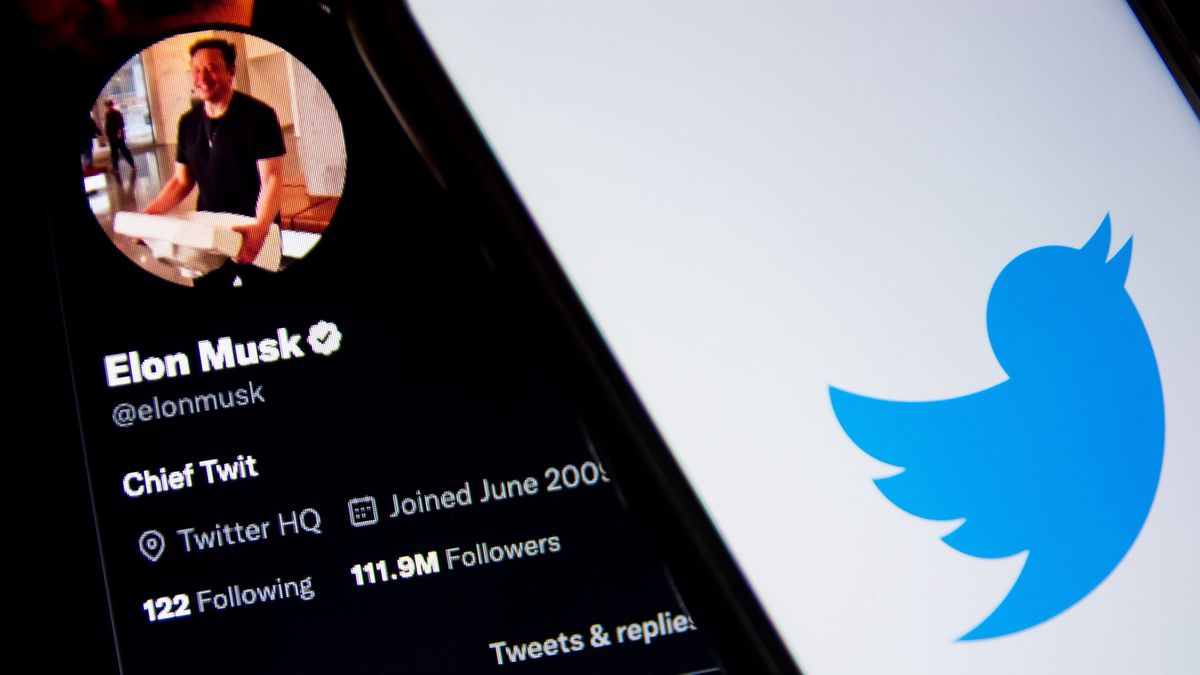 In this photo illustration a Twitter logo seen displayed on a smartphone screen with Elon Musk Twitter in the background in Athens, Greece on October 30, 2022. Elon Musk begins his Twitter ownership with firings. (Photo by Nikolas Kokovlis/NurPhoto via Getty Images)